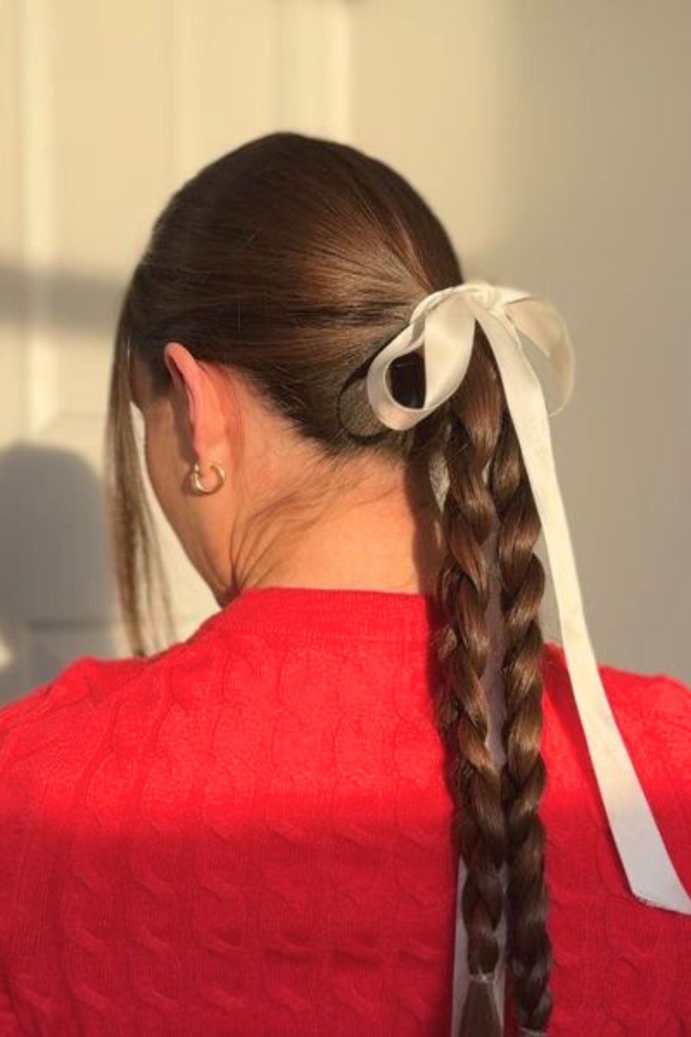 A woman with a textured winter haircut, showcasing depth and static-defying style